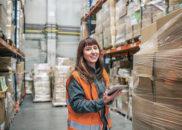 female tradie working in a warehouse